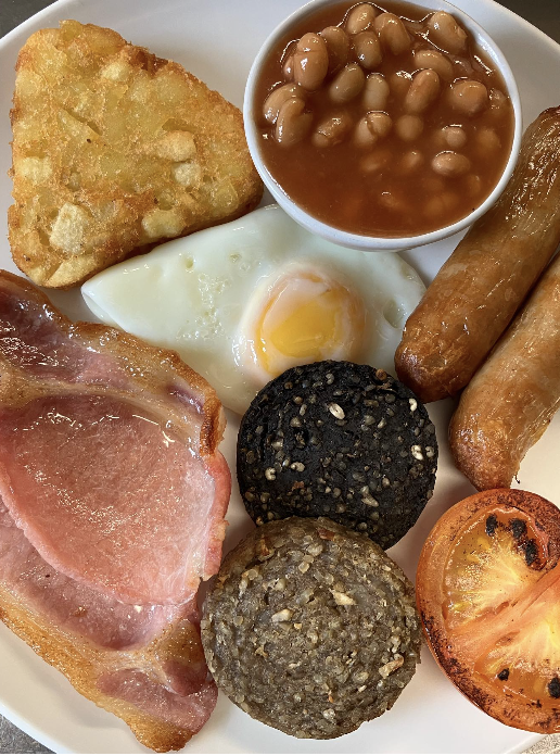 Traditional full Irish breakfast on a white plate at Molly's Cafe